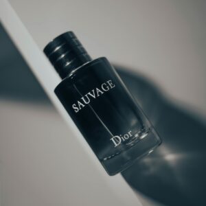 Stylish product shot of Dior Sauvage perfume bottle highlighting luxury and elegance on a white surface.